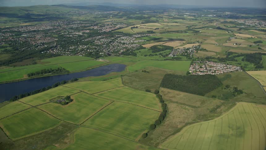 Aerial of a town surrounded by farmland