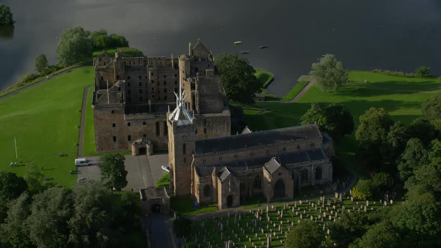 Aerial view of a church chapel and adjacent cemetery