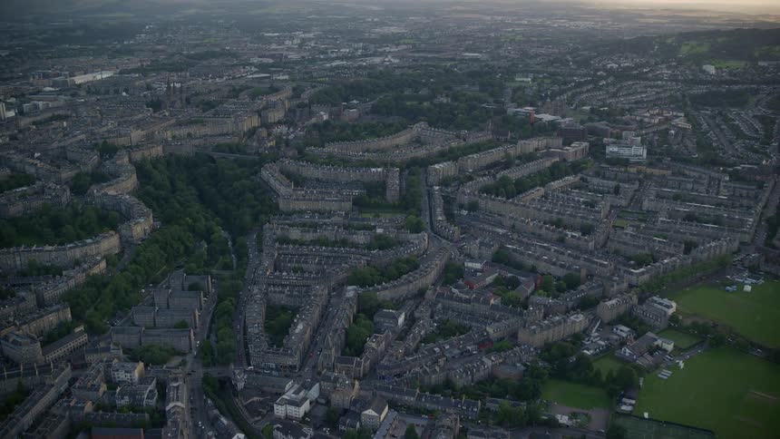 Aerial of a suburban neighborhood with greenery on the outskirts of the city