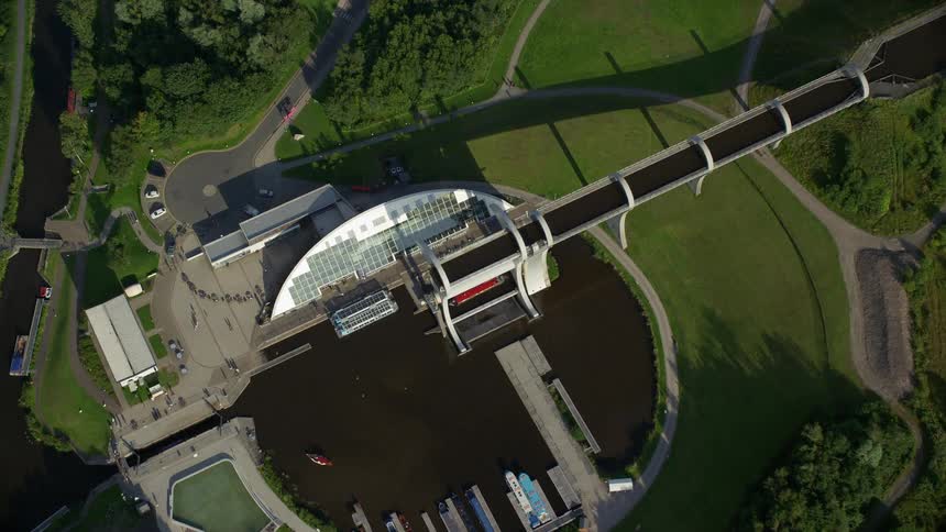 Aerial view of a public park with a lake amidst green fields