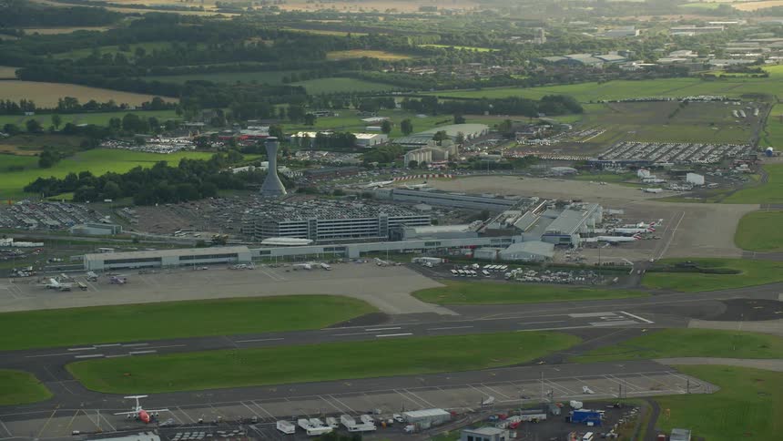 Aerial view of an airport terminal near a city