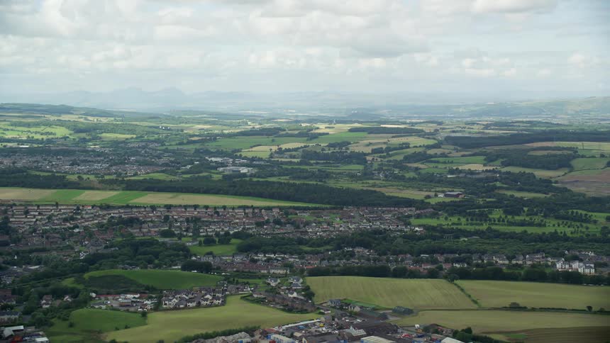 Aerial view of rural town with cloudy sky