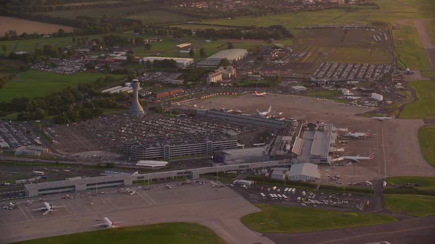 Aerial view of planes and runways on an airport at evening