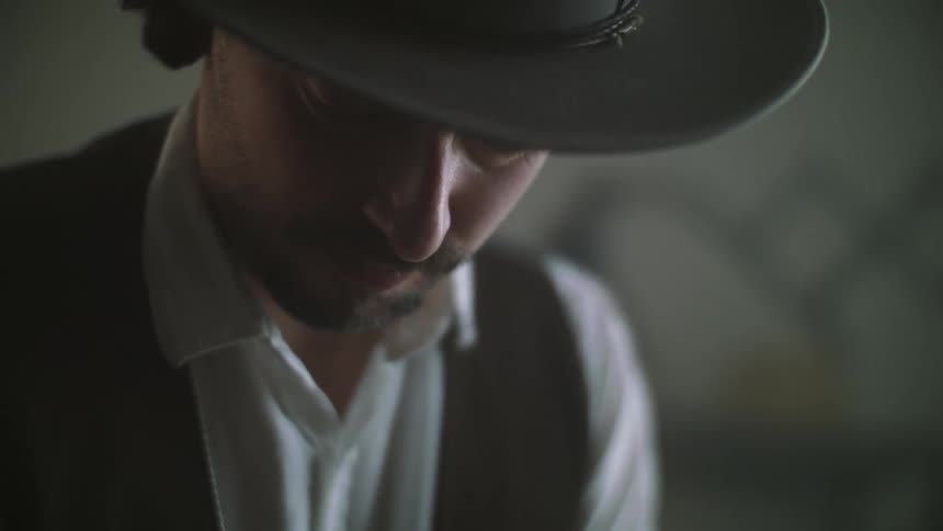 A concentrated man looking down