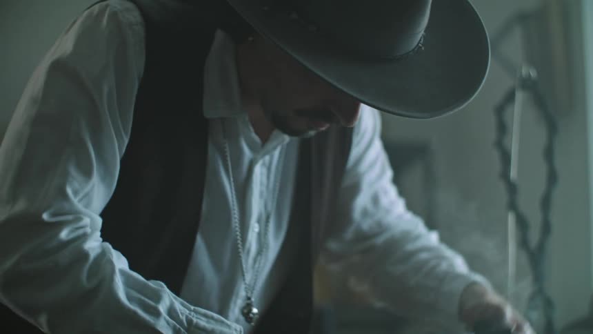 A man produces hats in a factory