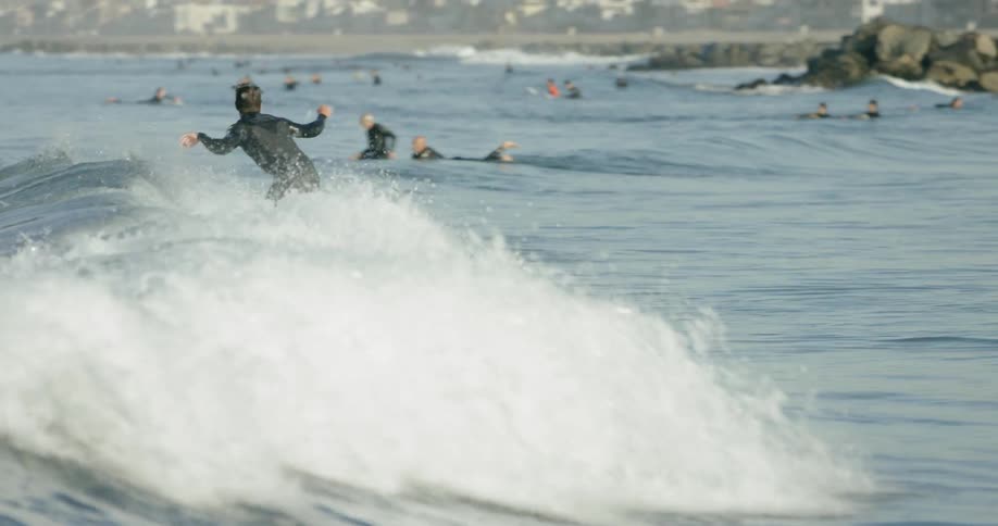 People are surfing in the water together