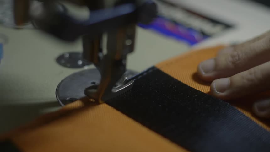 A person is using sewing machine