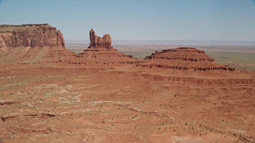 Aerial view of highway and rock formation in the desert