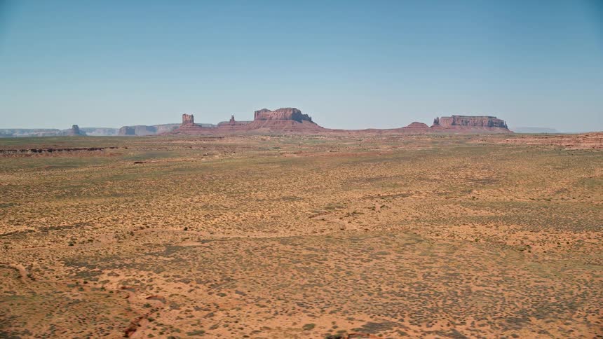 View of a natural environment with low vegetation a canyon and cliffs