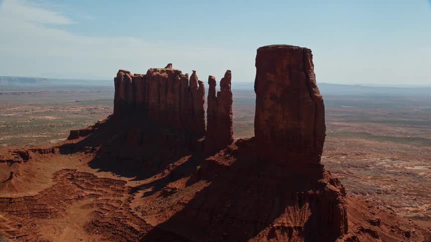 Aerial of wilderness with mountains and plateaus during a sunny day