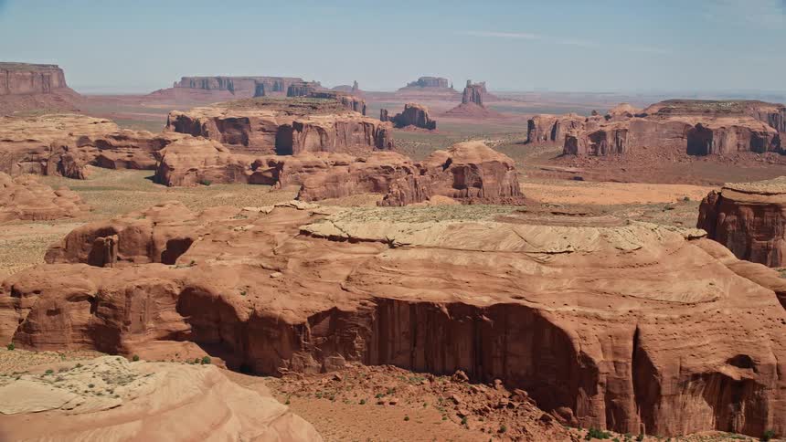 Aerial view of desert plateaus with hills and a rocky terrain