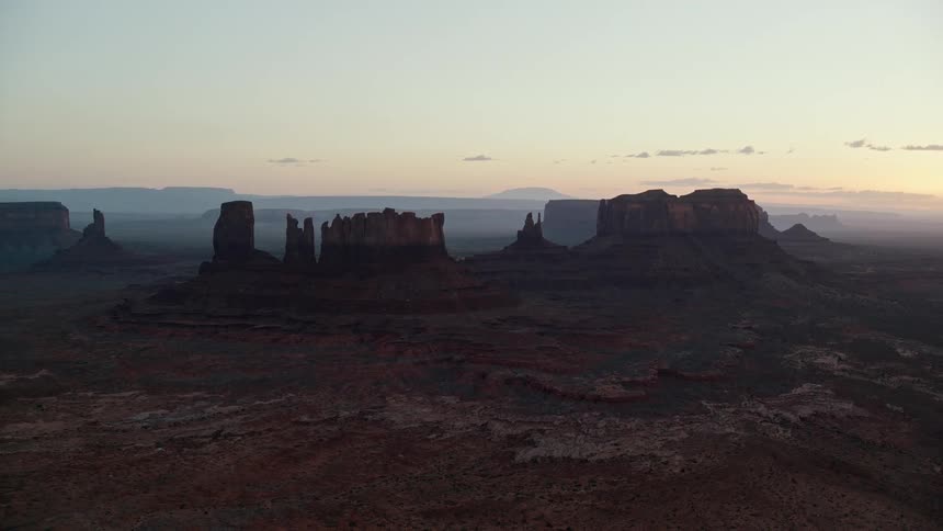 The sun is rising on the canyon