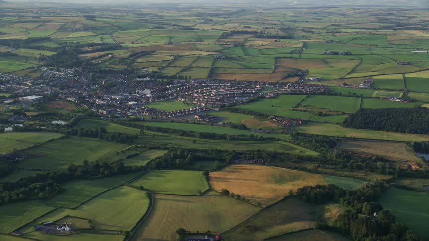 A small town in a rural area with pasture agriculture and lakes