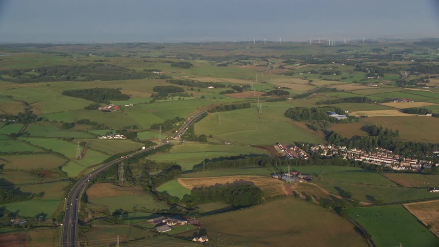 Aerial of a rural town with the main highway in the city