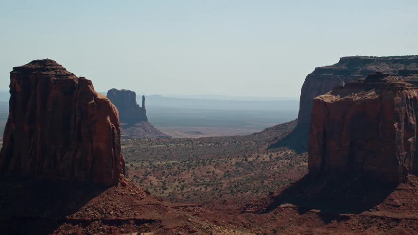 Aerial view of rocky canyons in an open environment with sparse vegetation