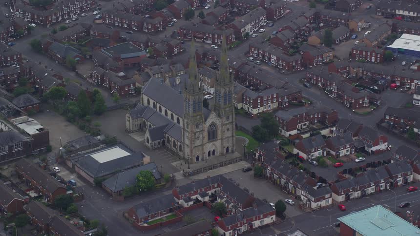 Aerial view of a church in the center of an urban area
