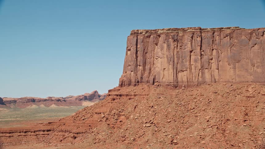 Drone view of a mountain rock formation with steep cliffs in the desert in the middle of the day