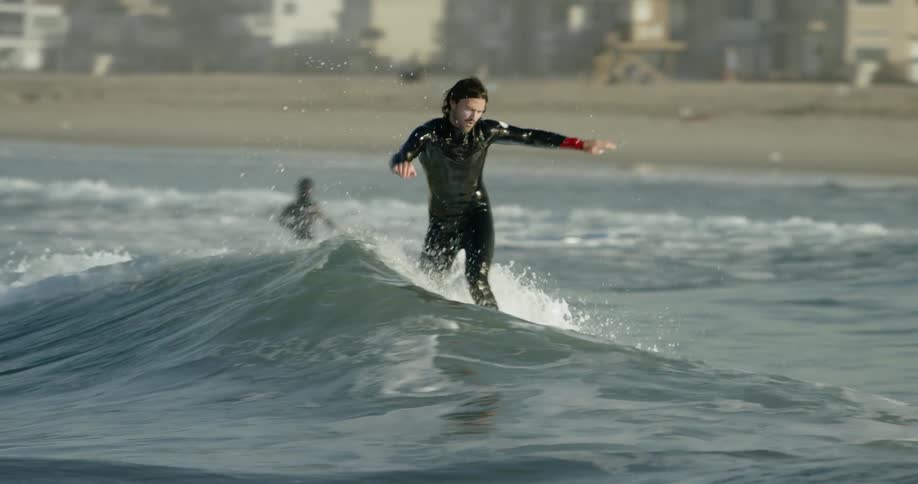Man rides on his surfboard