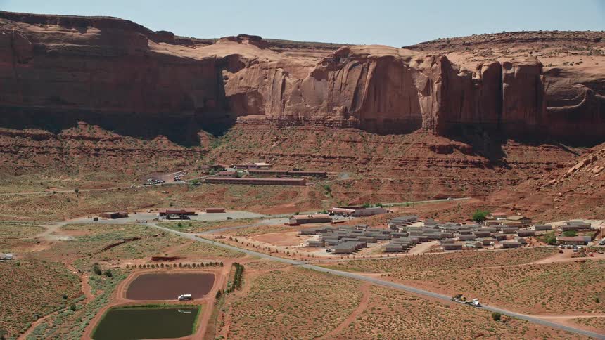 View of a small urban town on the edge of a canyon with water reservoirs