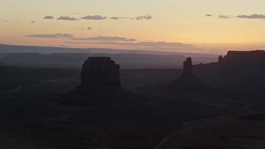 Aerial of a landscape with wild mountains at sunset