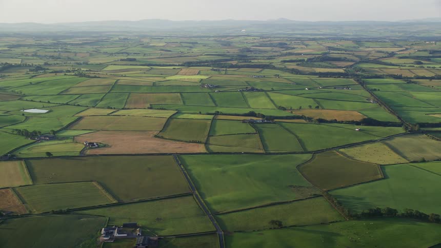 Aerial view of extensive farmlands in the countryside at daytime