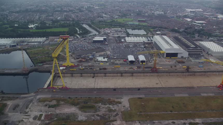 Aerial view of cranes on a shipping yard in the city