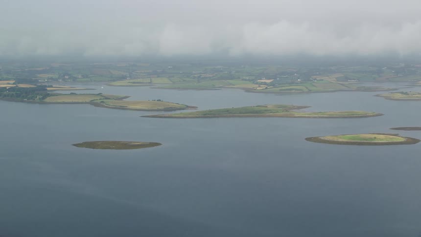 Aerial of the island with rural towns and a cloudy sky