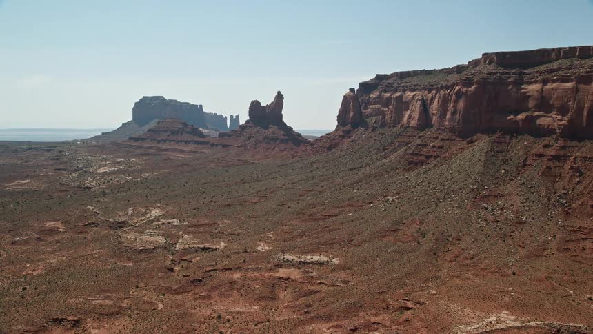 Aerial view of a natural environment with a valley cliffs and geological formations