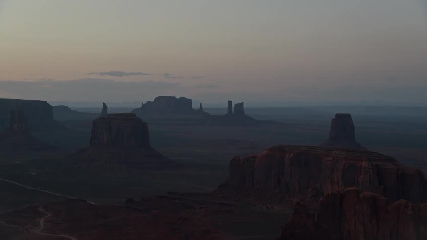 Aerial view of mesas in the desert badlands at sunset