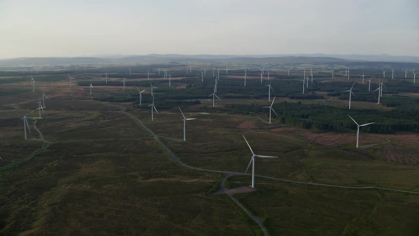 Aerial view of a wind farm in a field at daytime