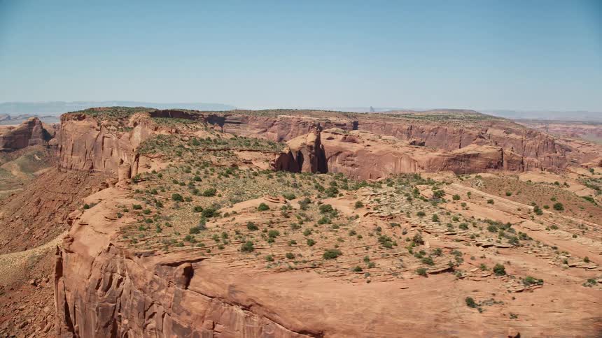 Aerial view of desert plateau with hills and a rocky terrain