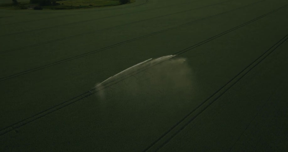 Aerial view of an irrigation system watering fields at morning
