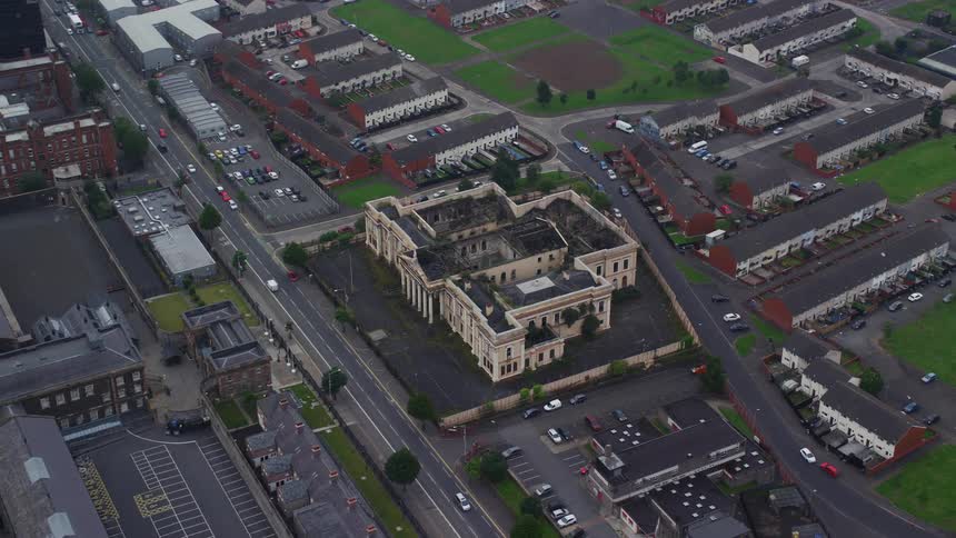 Aerial view of a large ornate stately manor in the city