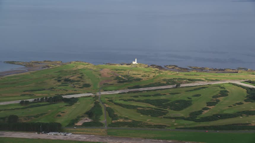 Aerial view of a rural area with fields by the seaside
