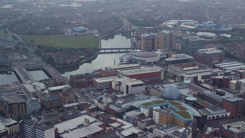 Aerial view of a city with bridges a lake and green areas