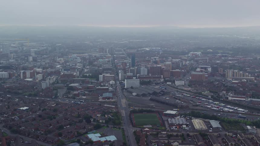 Aerial view of highways parking lot and buildings in the city