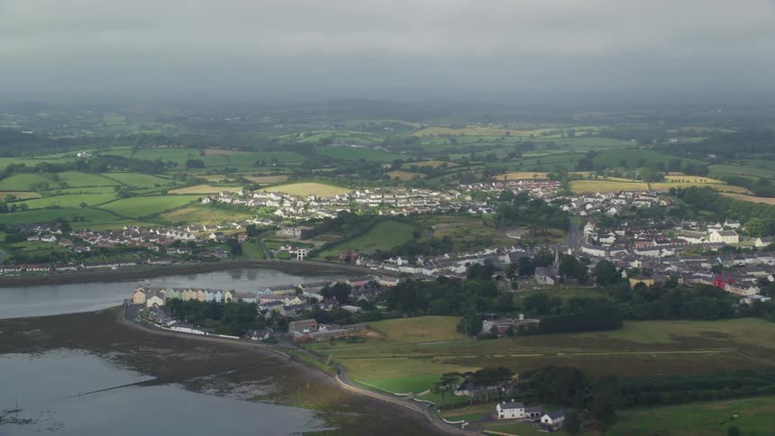 Aerial view of a small town next to a lake in the countryside