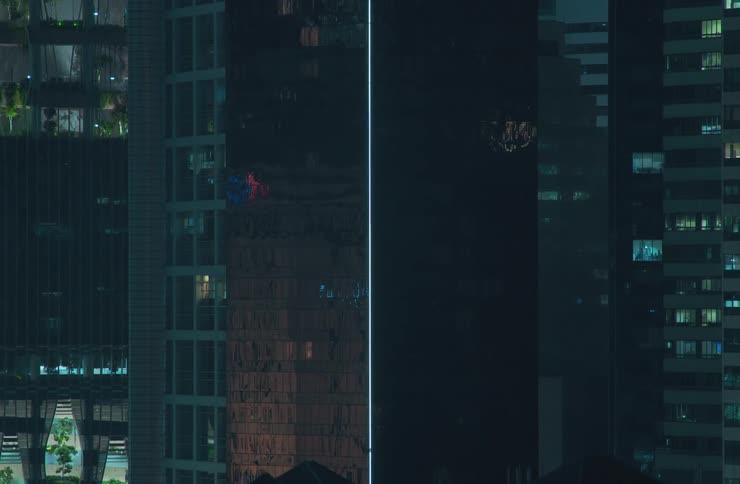 Window lights of apartment buildings on metropolitan area during night time turn off
