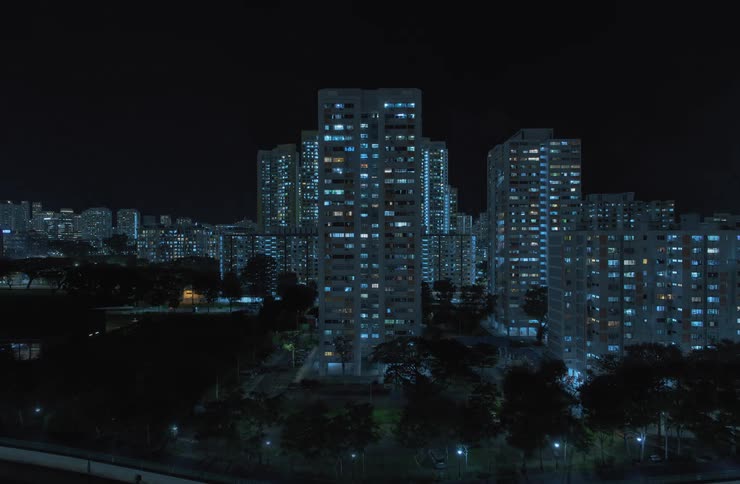 Lights turn off and go out on the city skyline at night