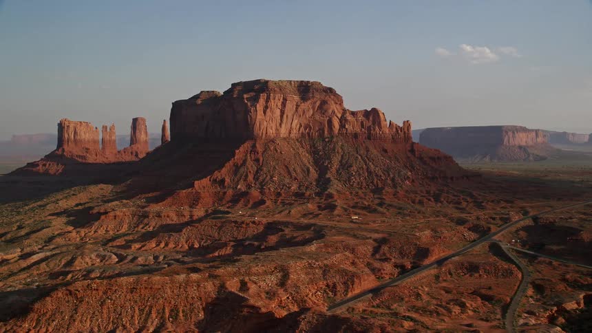 A large mesa rocky formation in desert