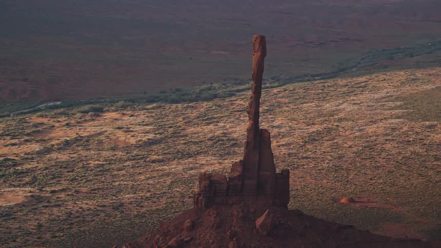 Rock formation towers over scrubland