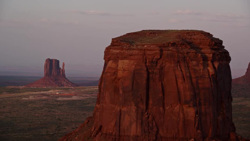 Aerial of butte formations in the desert on a wide open landscape in the summer during the day