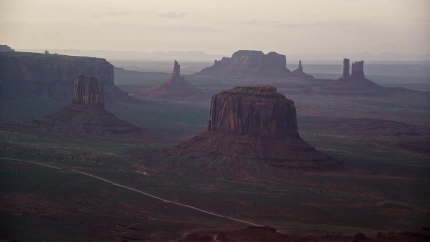 From above the plateaus rise amidst the vast desert