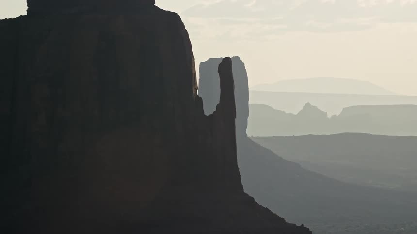 Aerial of the west and east mitten buttes in arizona at sunrise