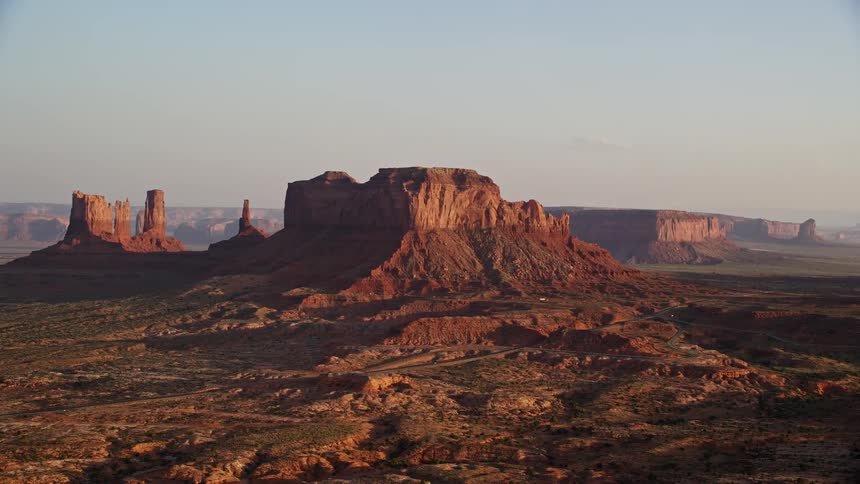 Aerial view of mesas and buttes in the badlands at sunset