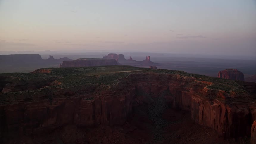Aerial view of mesas in the desert badlands at evening