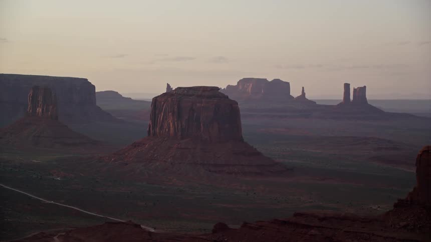 Aerial view of mesas in the desert badlands at sunset