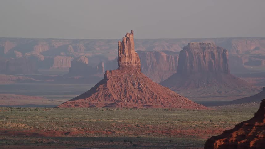 Aerial view of a butte surrounded by mesas in the badlands