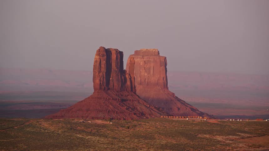 Drone view of rock formations in the desert near a rural landmark viewing area