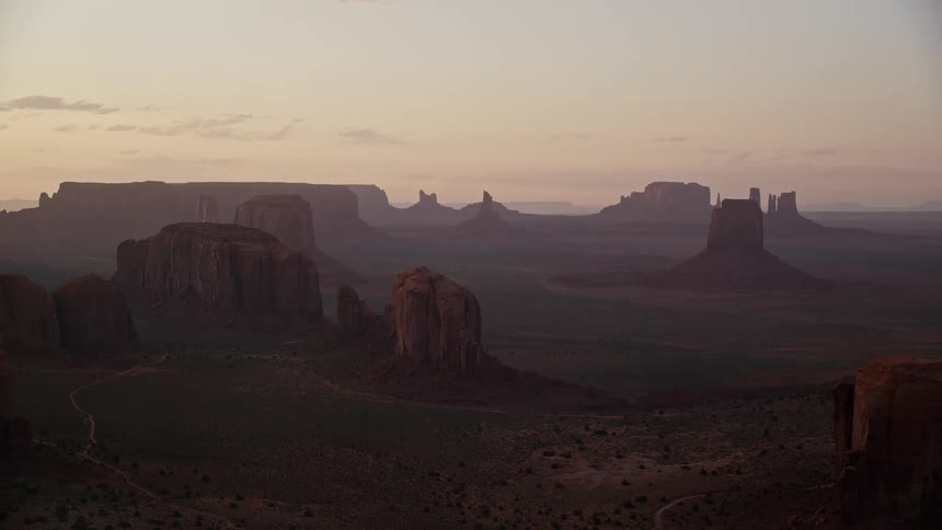 A desert region with canyons and rocky mountains